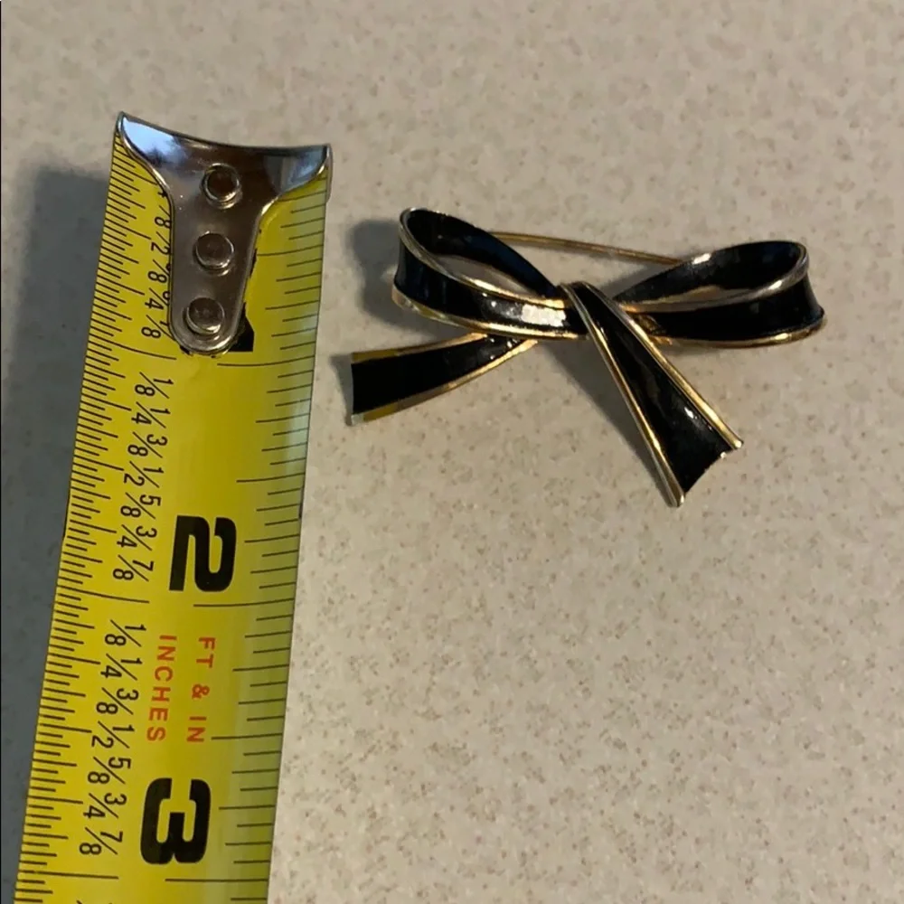Trifari black gold bow pin